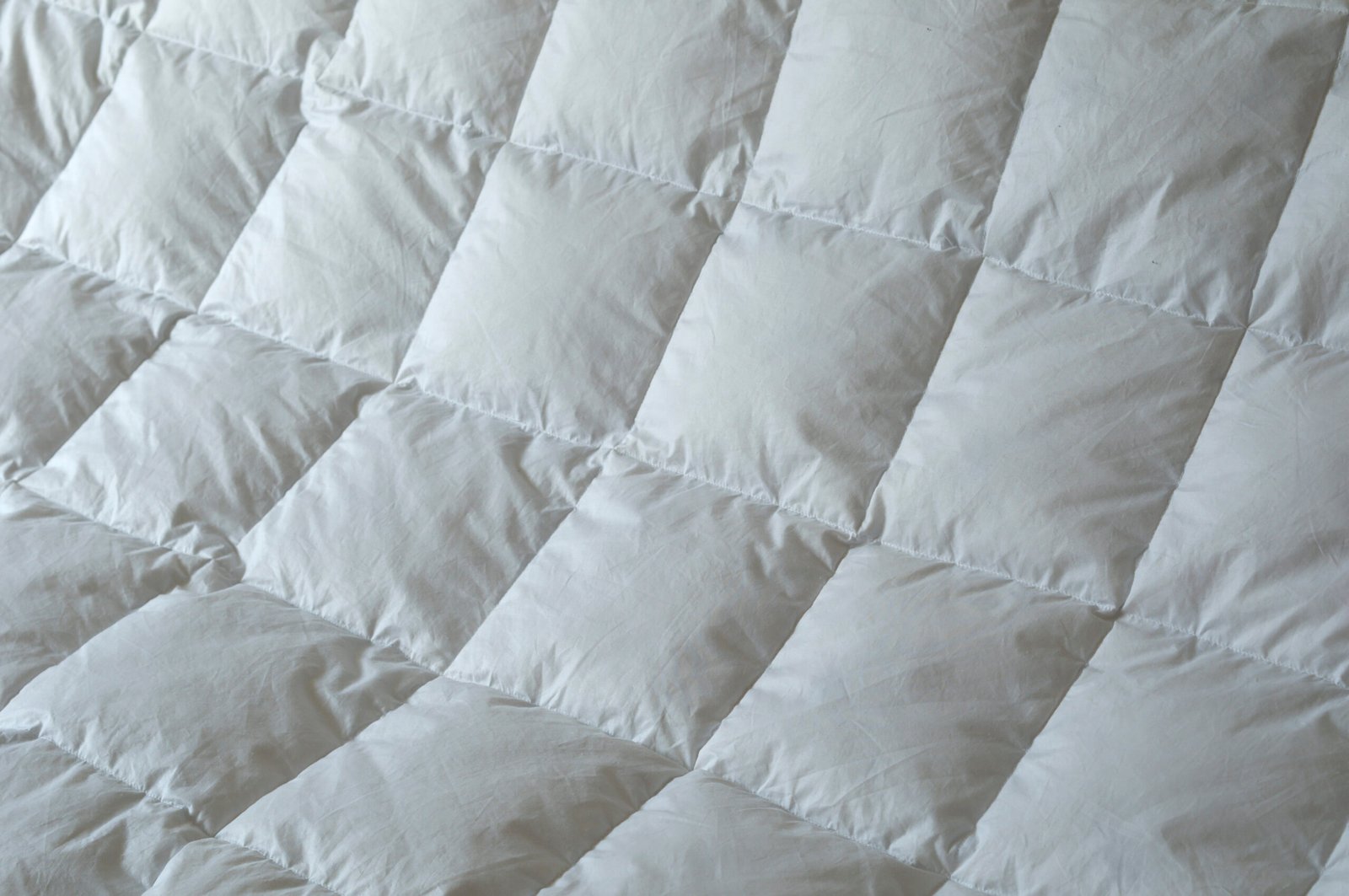 Detail of down comforter with white squares