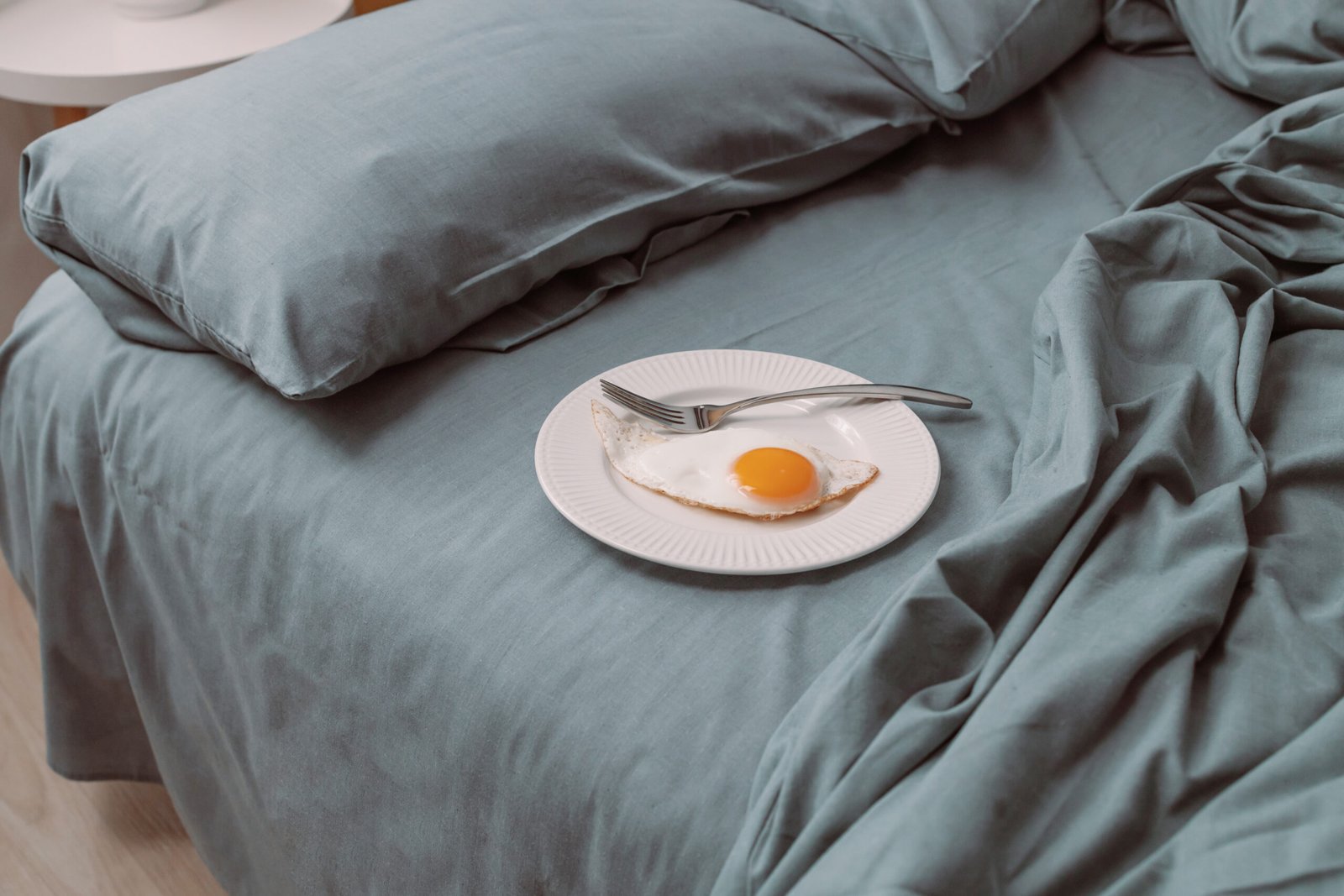 Morning. Tasty healthy breakfast with fried eggs on bed